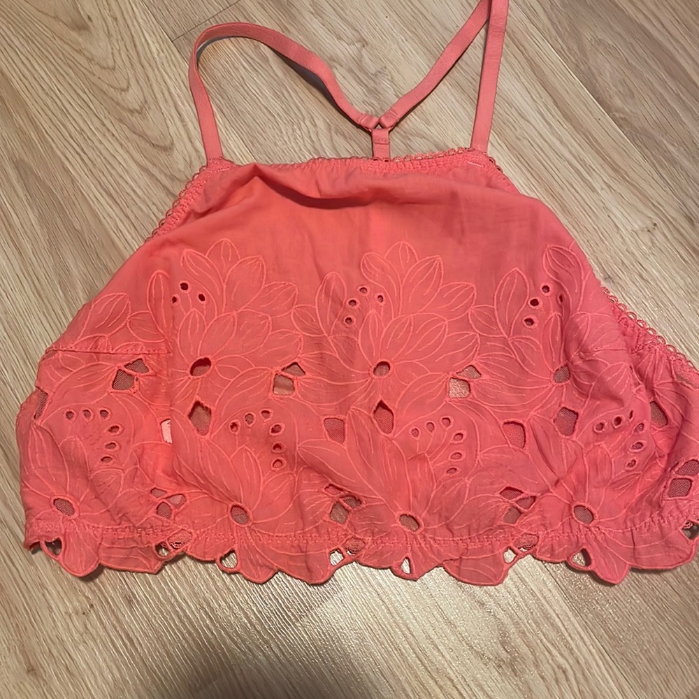 Free people crop top, it’s a large but it looks super small.
